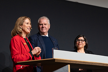 © Deutsche Messe AG. From left to right: Evelyne Coulombe, Chargée d'affaires a.i. for the Embassy of Canada to Germany; Jayson Myers, CEO of Next Generation Manufacturing Canada; and Christina Bilyk, Executive Lead for Canada at HANNOVER MESSE 2025, speaking at the HANNOVER MESSE 2025 Press Preview. The Canada Partner Country 2025 logo is projected above them.